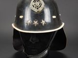 an old fireman ' s helmet with stars on the side