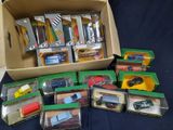 a box full of assorted toy cars on a table