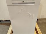 a white dishwasher sitting on a pallet in the middle of a room