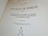 an open book with a drawing of a vase on it