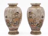 pair of asian vases with asian scenes on them on a white background