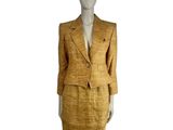 an image of a mannequin wearing a suit and skirt