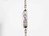 an image of a woman ' s wrist watch with a pink stone