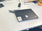a laptop computer sitting on a desk with a mouse on it
