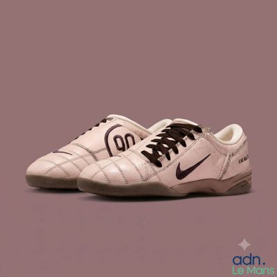a close up of a pair of white shoes with black laces