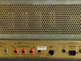 a close up of an old amplifier sitting on top of a table