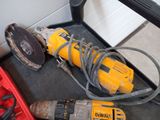 two tools that are sitting on the floor next to each other