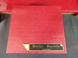 the red book is sitting on a black table