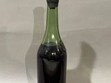 a bottle with a liquid inside of it on a table