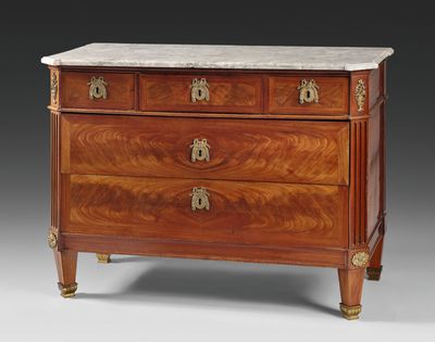 an antique chest of drawers with marble top