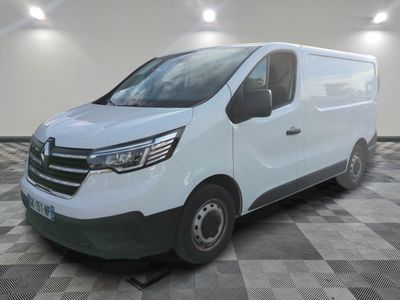 the white van is parked on a checkered floor in a room