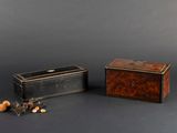 two small wooden boxes sitting next to each other on a black surface