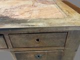 a wooden table with two drawers on top of it