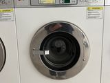 a washing machine that is sitting next to each other