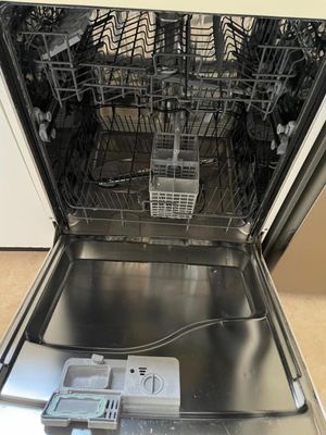 a dishwasher with a lot of dishes inside of it