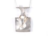 silver plated pendant with a bird on a branch on a chain