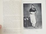 someone is holding an open book with a picture of a man in uniform