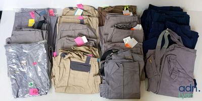 a lot of clothes and a bag on the table