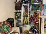 a room with a lot of bags and bags on the shelves