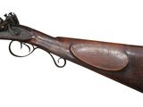 an old rifle with a wooden handle and a leather case