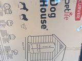 cardboard box with a picture of a dog inside of it sitting on the floor