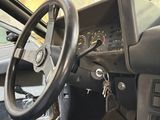 a car dashboard with a steering wheel and a dash board