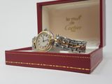 a watch sitting in a box on a white surface