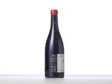 a bottle of wine that is sitting on a table