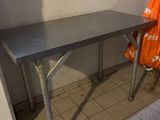 a table with a towel hanging on it in a room