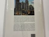 the back cover of a book with a picture of a cathedral in the background