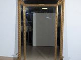 a large mirror sitting on the floor in a room