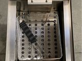 a close up of a fryer sitting on top of a counter