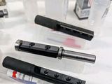 many different types of pens sitting on a table
