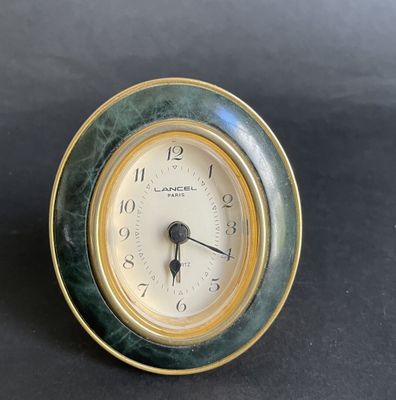 a small clock that is sitting on a table