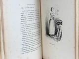an open book with a drawing of a woman and a man