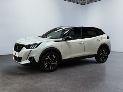 the white nissan suv is parked in a white room