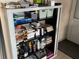 a small cabinet with a lot of stuff in it