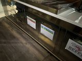 an image of a restaurant kitchen with a counter and a sink