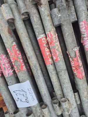 a lot of pipes that are stacked up together