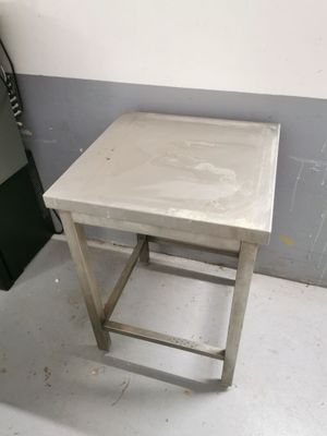 a small table that is in the corner of a room