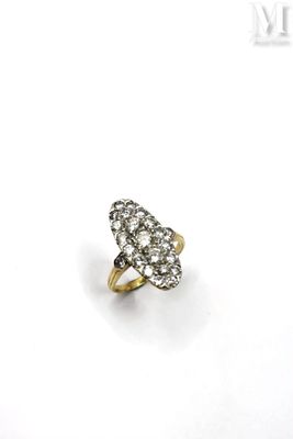 a close up of a diamond ring on a white surface