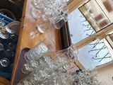 a lot of empty wine glasses sitting on a table