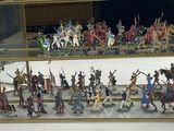 many figurines in a glass case on the table