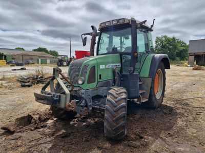 a tractor that is sitting in the dirt