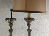 two lamps that are sitting on a table
