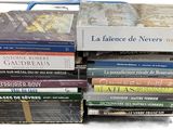 many books stacked on top of each other on a table