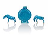 three pieces of blue glass with a horse on it