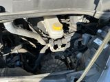 the engine of a car with the hood open and the hood down