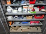 a metal shelving with lots of items on it