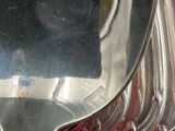 a silver spoon sitting on top of a red book